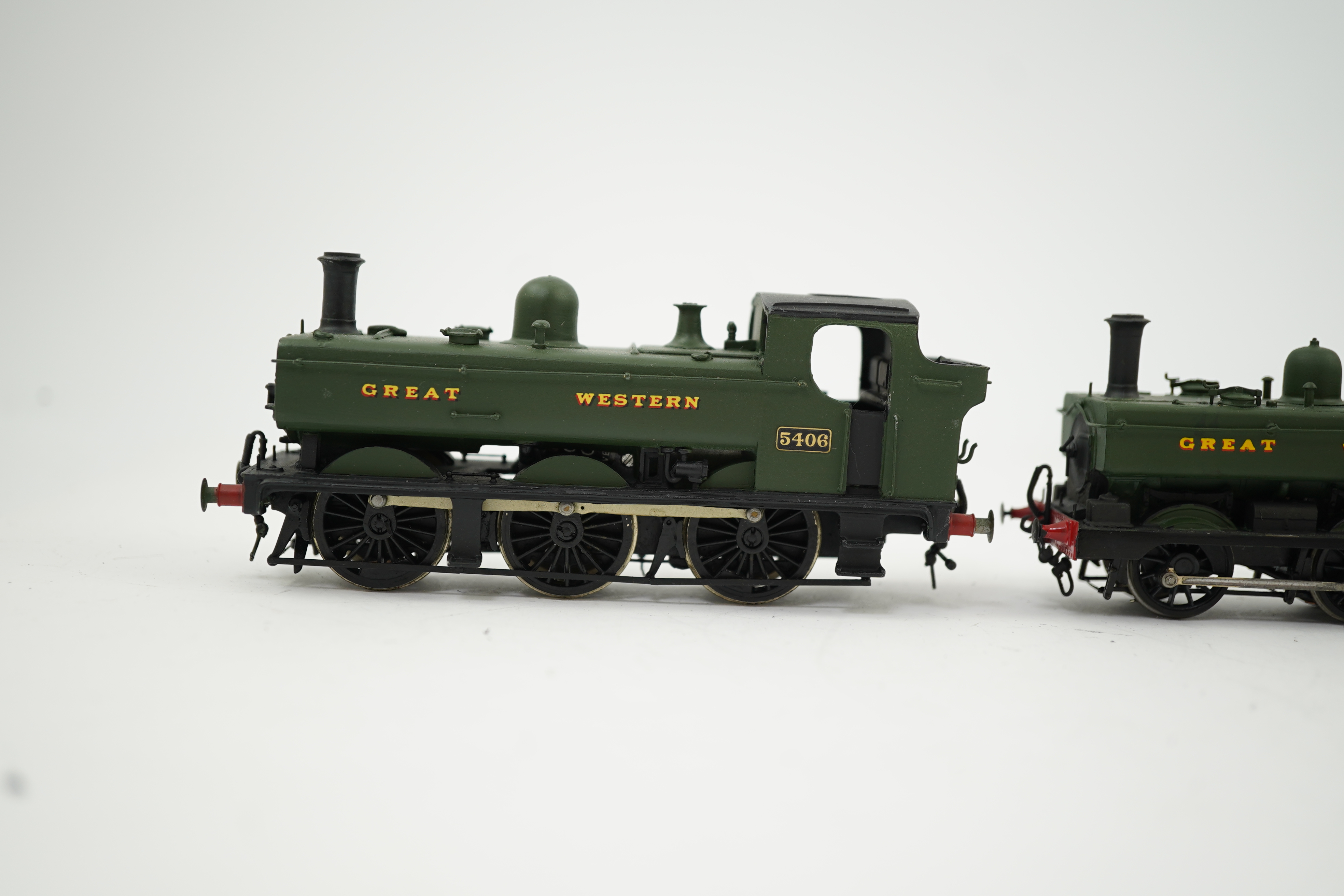 Three 00 gauge brass and white metal kit built GWR tank locomotives; a 15xx class 0-6-0T, 1500, together with an 54xx class 0-6-0PT, 5406, and a 19xx class 0-6-0PT, 1925, all constructed, painted and lined to a high stan